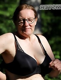 A thin seasoned woman playfully engages with her partner