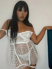 Lisa Essex is a MILF and she wears a wet look minidress to entice you.