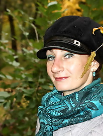 Aroused aged businesswoman is spreading her legs