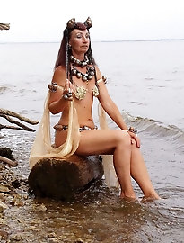 A lovely older woman is posing nude