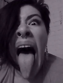 A mature woman performs oral sex and holds semen in her mouth